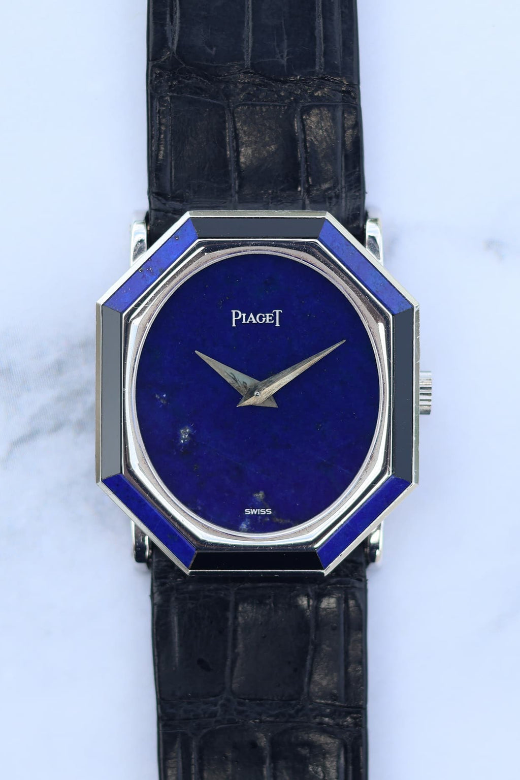Close-up of Piaget 9341 dial featuring deep blue lapis lazuli and contrasting onyx and lapis bezel segments