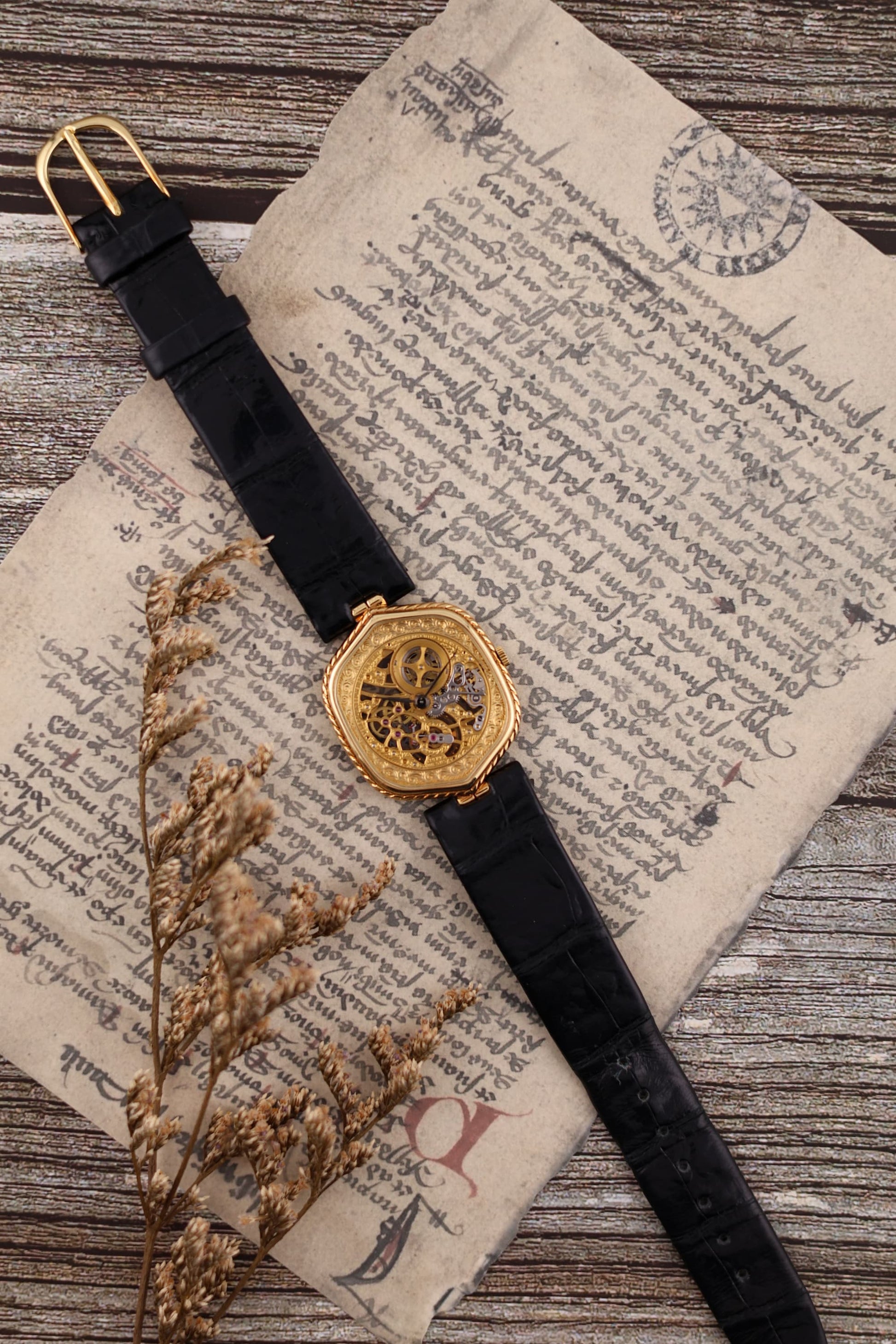 Audemars Piguet 1980s skeleton watch in 18K yellow gold with engraved skeleton dial and black leather strap