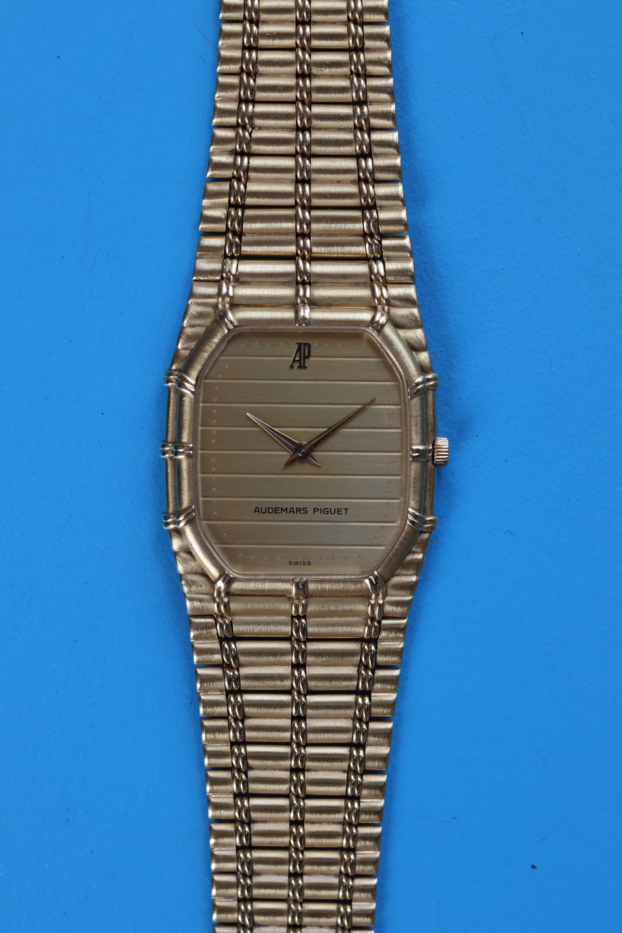 Semi-close view of AP Bamboo dial with gold-tone ribbed texture and minimalist hour markers