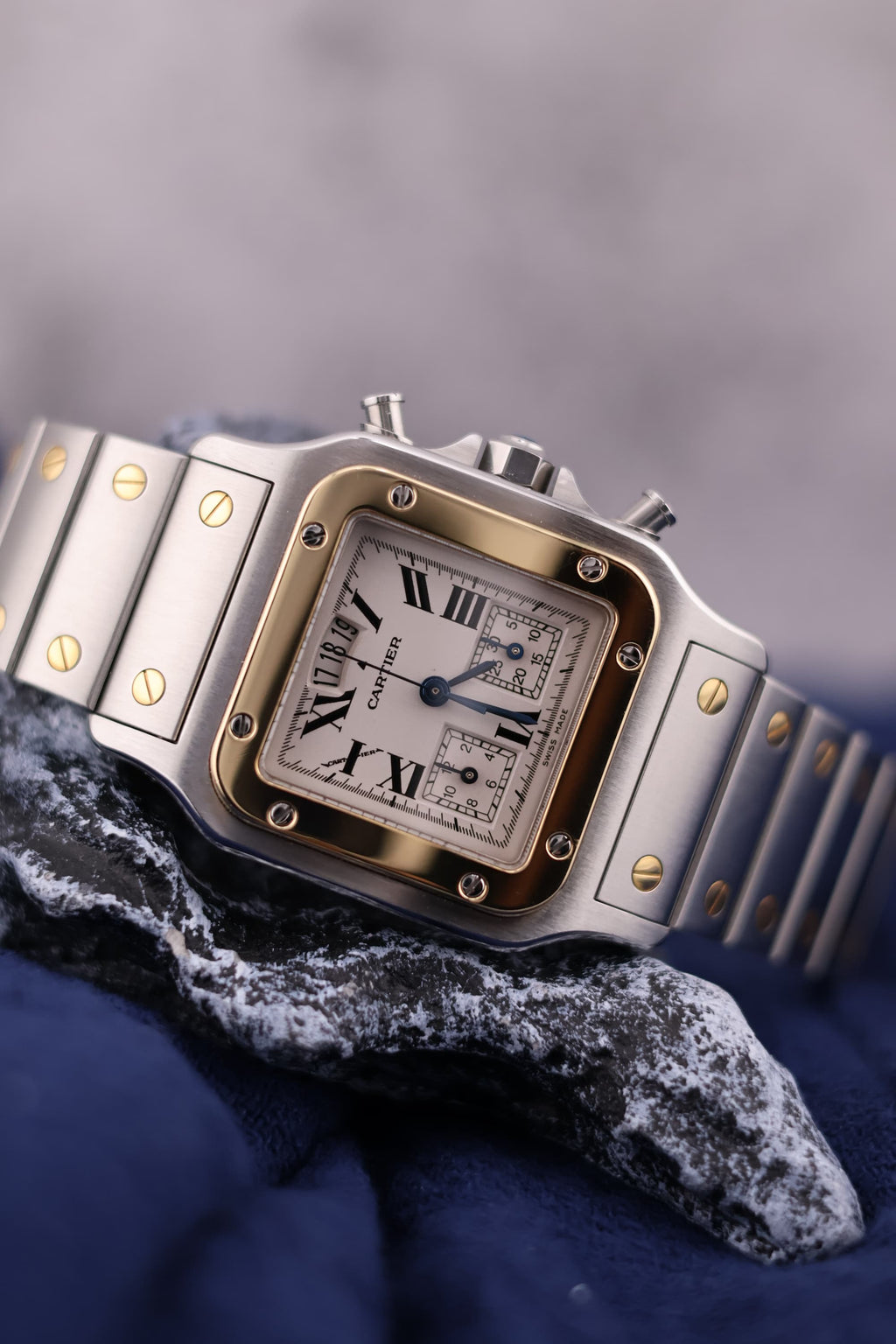 Close-up of Cartier Santos Chronograph Ref. 2425 dial with two subdials, date at 12, and Roman numerals