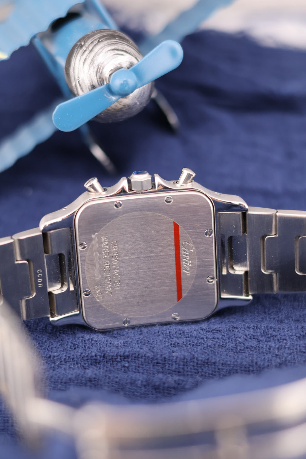 Case back of Cartier Santos Chronograph Ref. 2425 in stainless steel, showing Cartier engravings