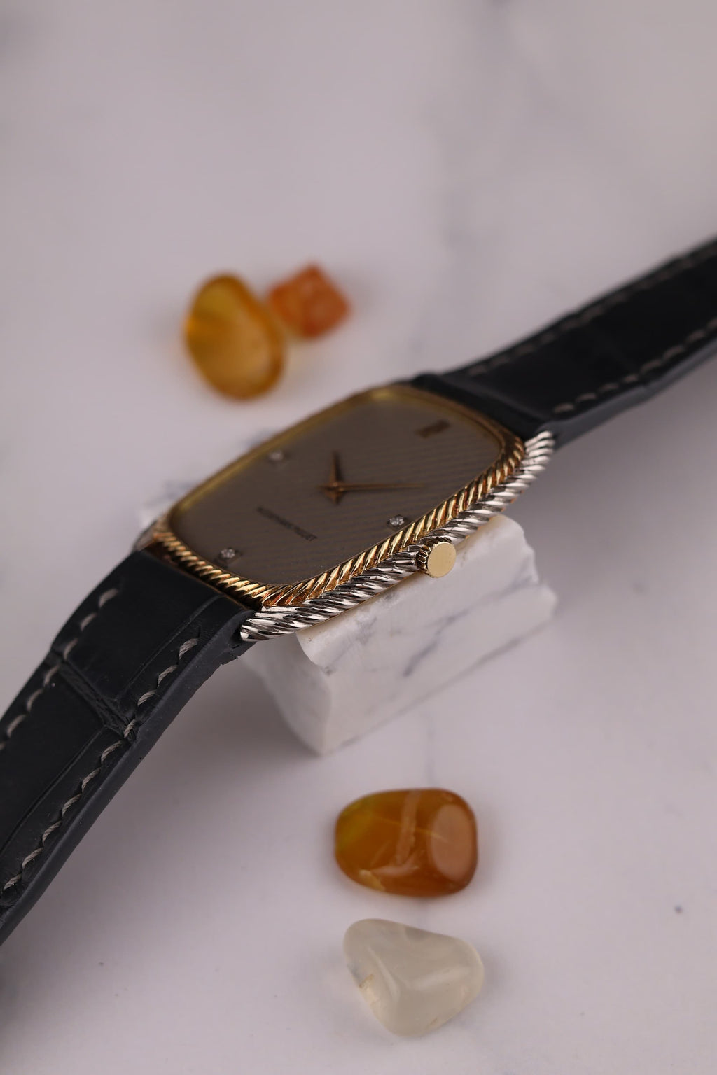 Crown-side view of Audemars Piguet 1970s dress watch highlighting yellow gold crown and case detailing