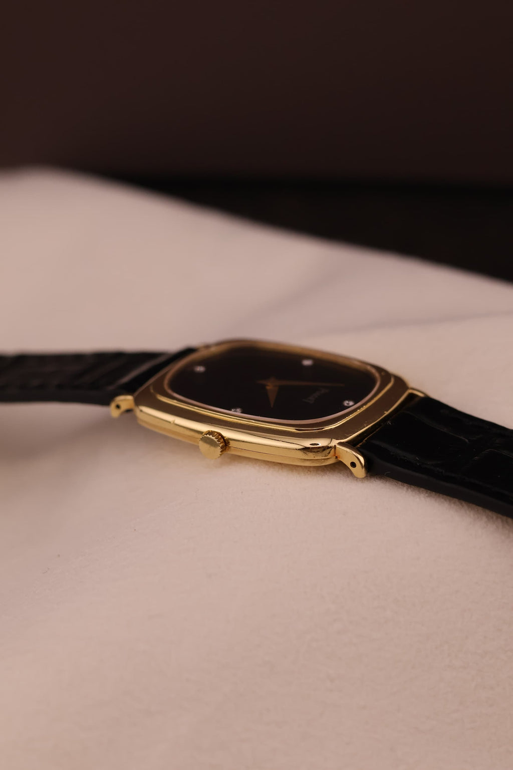 Close-up of the Piaget watch crown and case side, displaying fine finishing and slim profile.