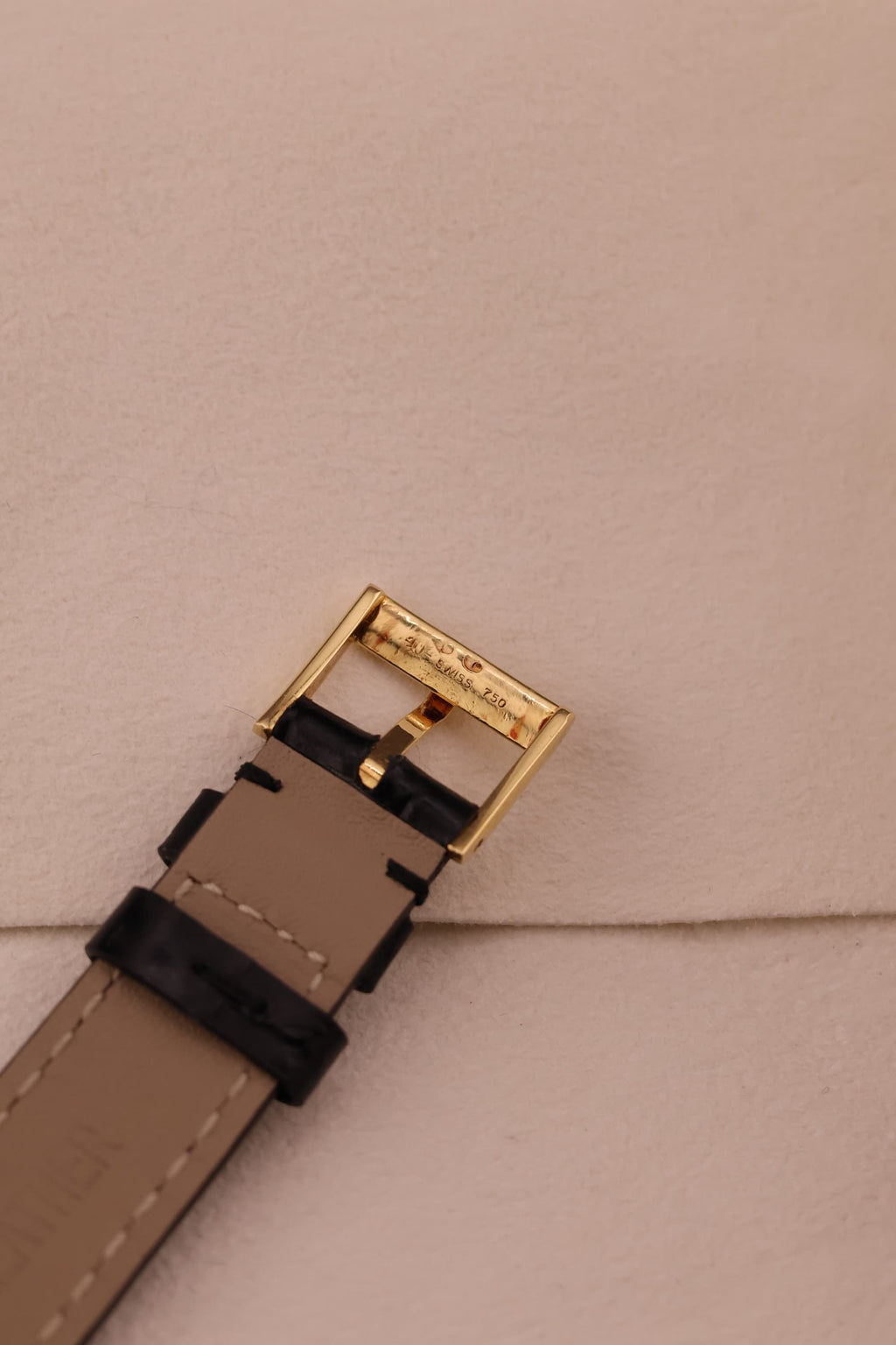 Underside view of the Piaget buckle, revealing hallmark and clasp detailing.