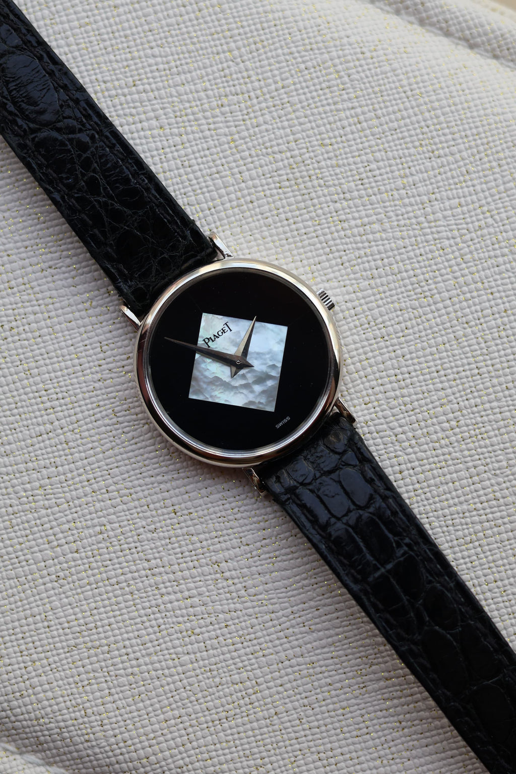 Full view of the Piaget Ref. 922 vintage dress watch in 18K white gold, shown with original black alligator strap and minimalist Art Deco-inspired dial.