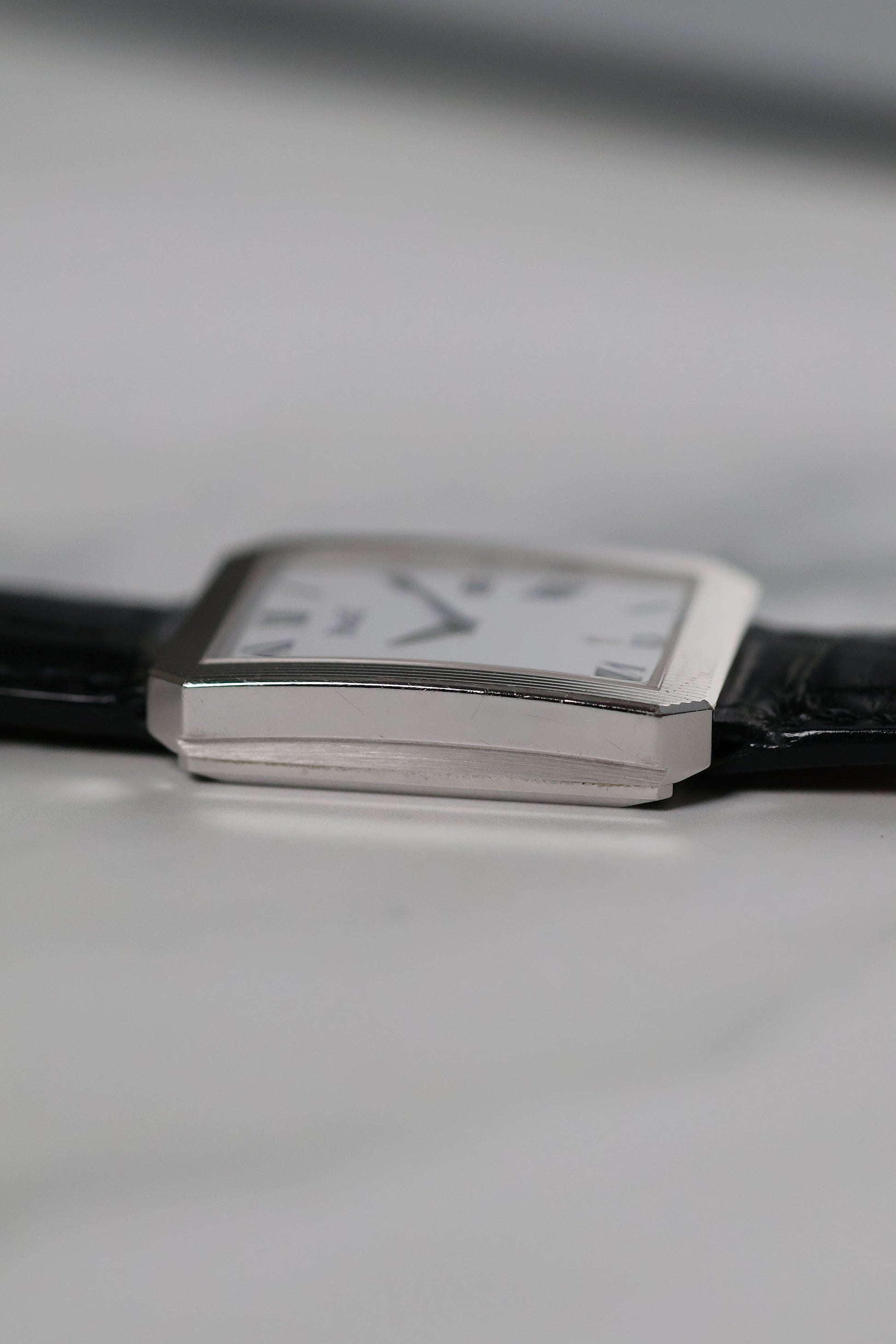 Profile view of Piaget Ref. 26354 highlighting slim case, fluted sides, and integrated lugs.