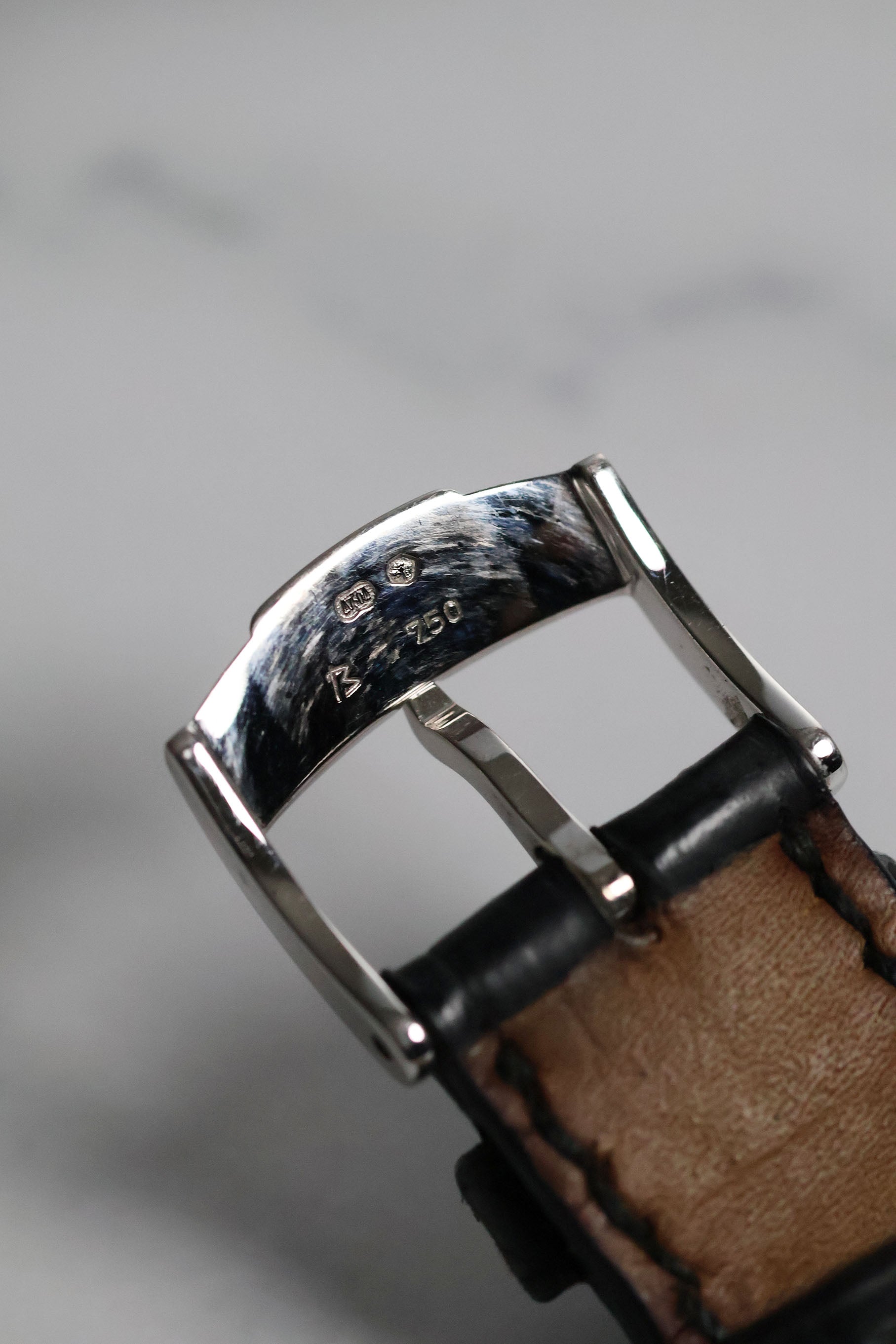 Underside of original Piaget 18K white gold buckle showing hallmark and clasp construction.