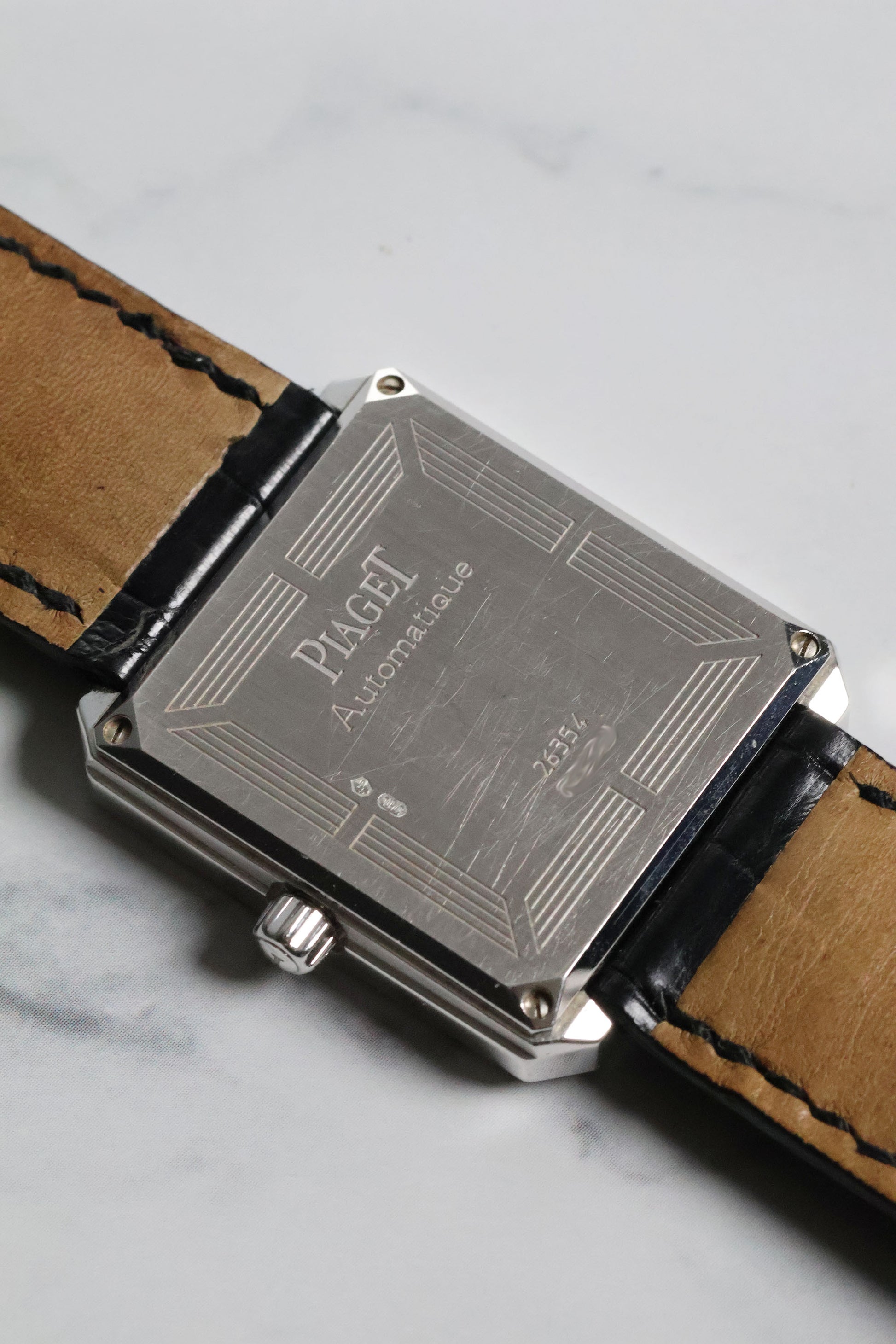 Rear view of Piaget Ref. 26354 automatic movement case back in solid white gold.