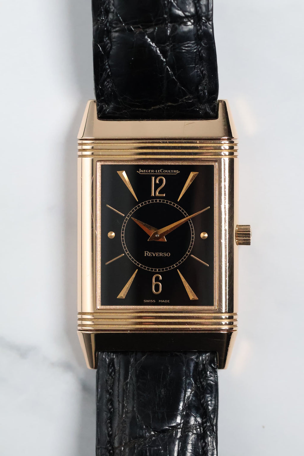 Front view of Jaeger-LeCoultre Reverso 250.2.86 in 18K rose gold with rare black dial and gilt markers.