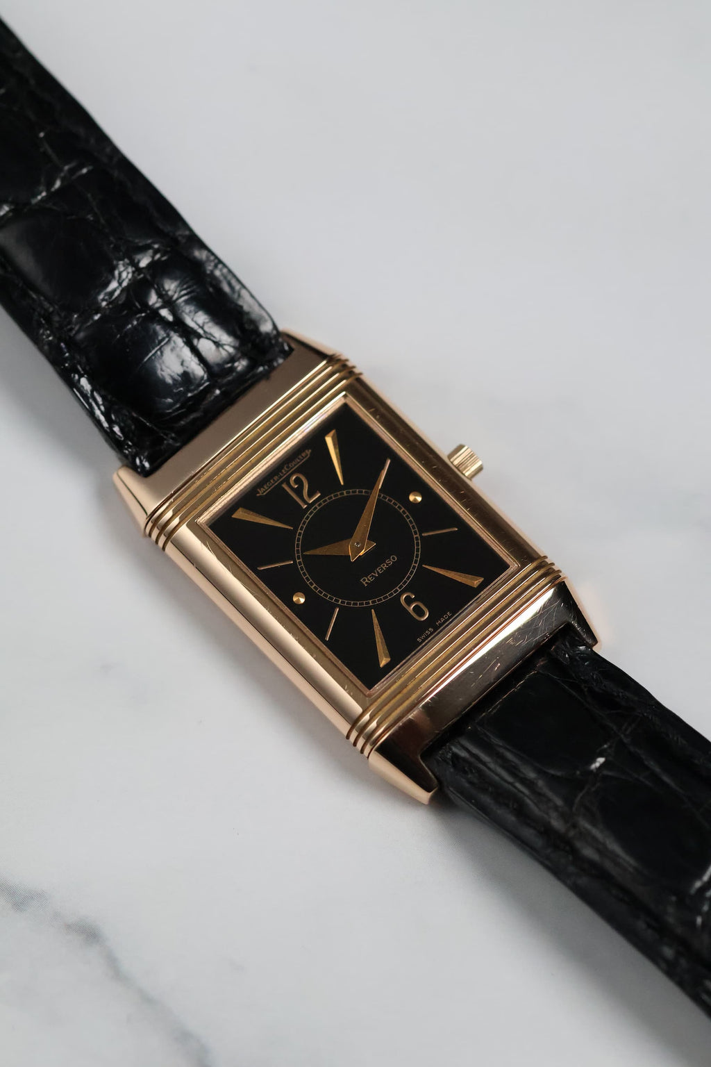 Close-up of the Reverso 250.2.86 on leather strap, emphasizing its Art Deco design.