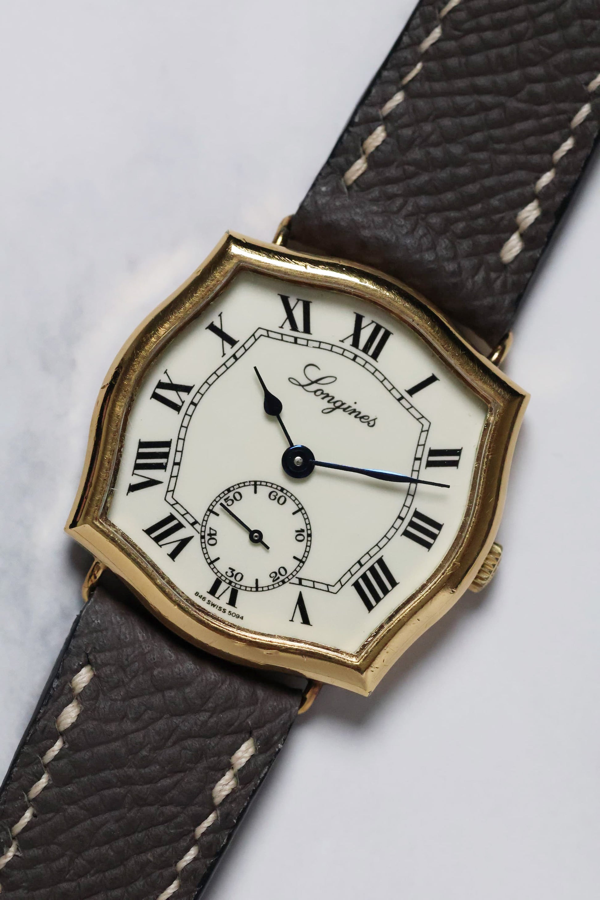 Angled overview of the Longines Sympathie-style watch showcasing its sculptural lugs and elegant proportions.