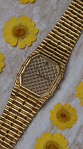 Audemars Piguet Bamboo 27mm watch with pavé diamond dial and 18K yellow gold bracelet – front view.