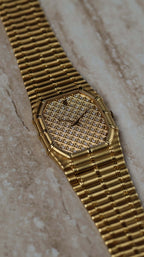Elegant wristwatch view of the Audemars Piguet Bamboo 27mm in 18K yellow gold with diamond-set dial.