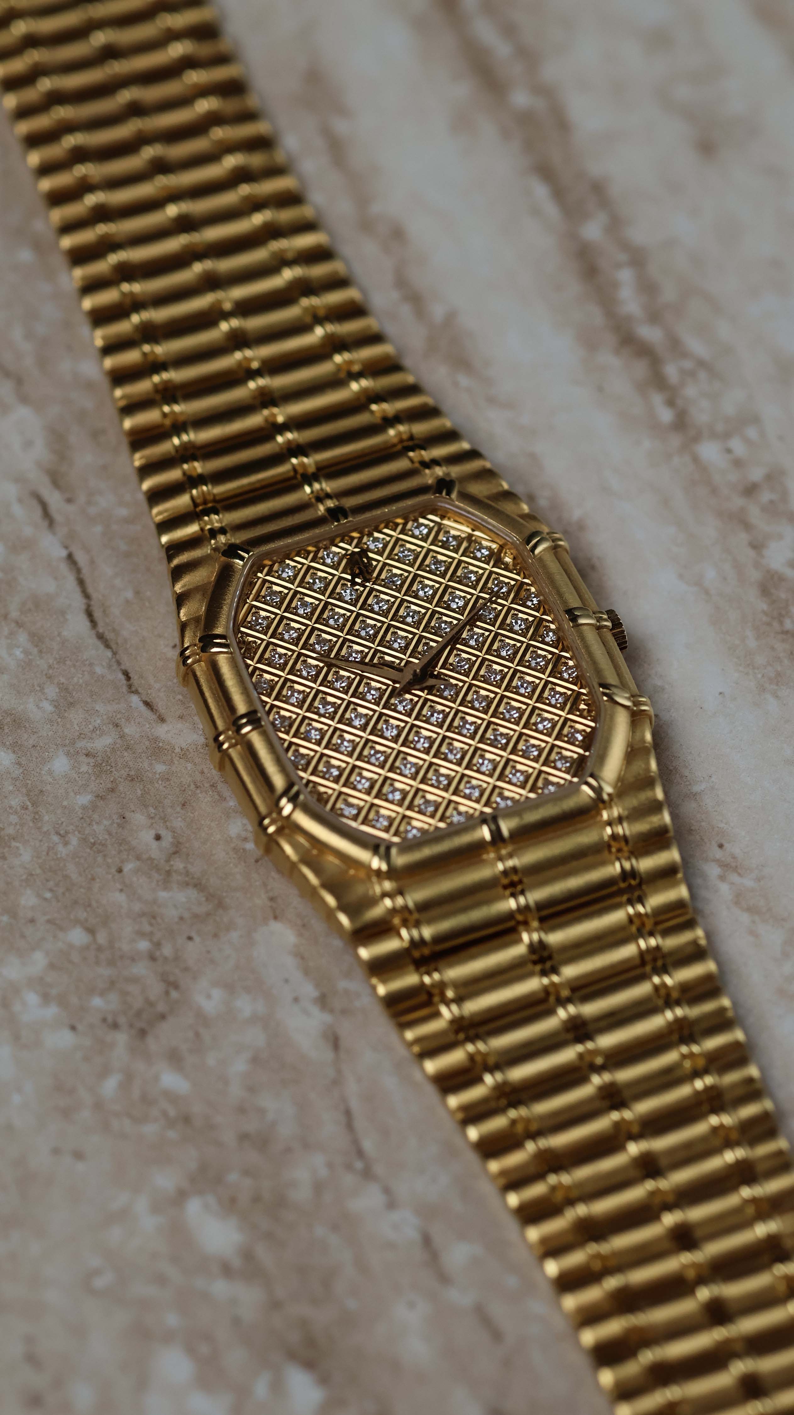Elegant wristwatch view of the Audemars Piguet Bamboo 27mm in 18K yellow gold with diamond-set dial.