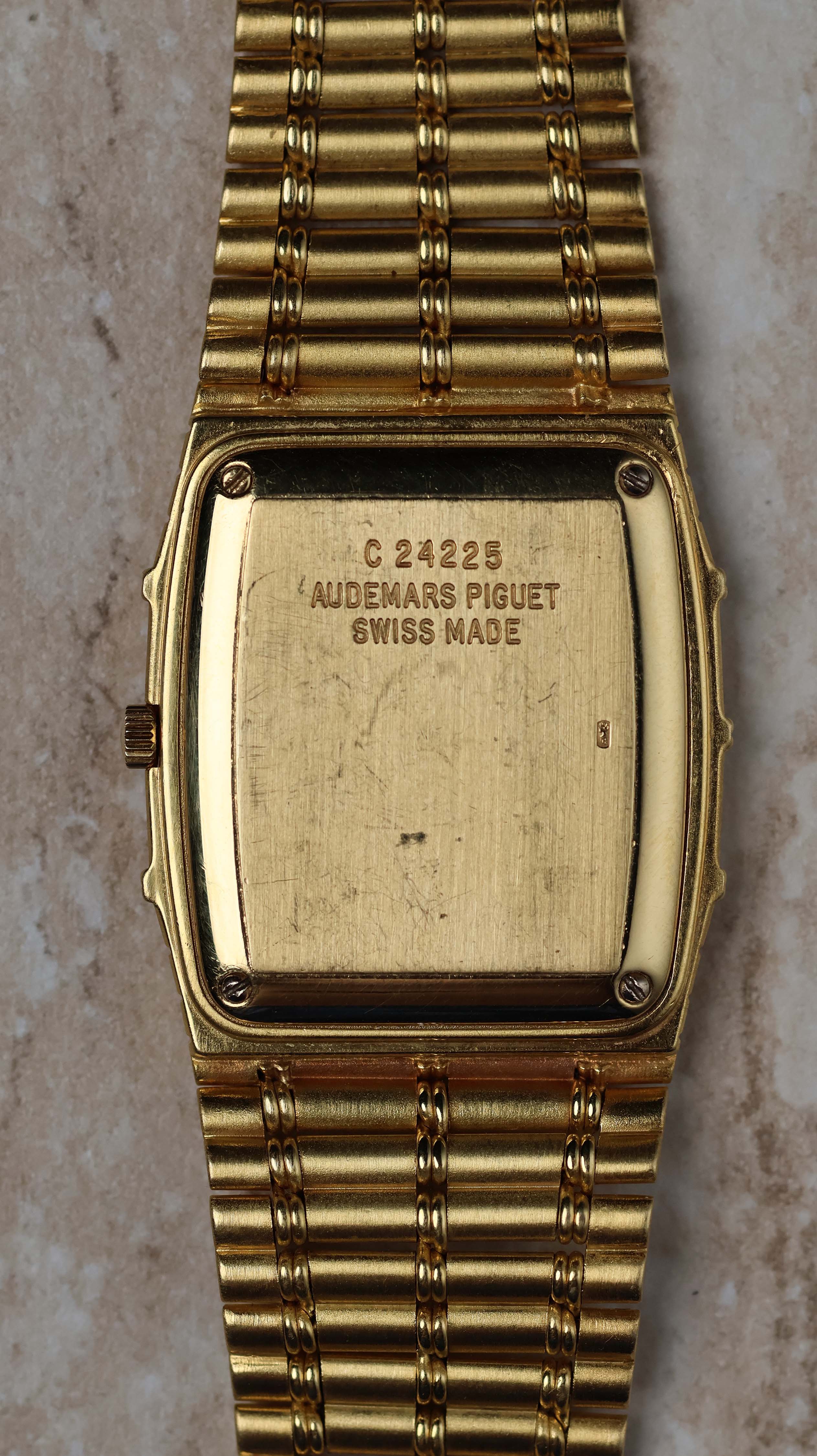Rear view of the Audemars Piguet Bamboo 27mm showing the solid 18K gold case back with hallmarks.