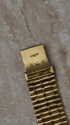 Underside of the clasp mechanism on the Audemars Piguet Bamboo 27mm bracelet – gold construction detail.