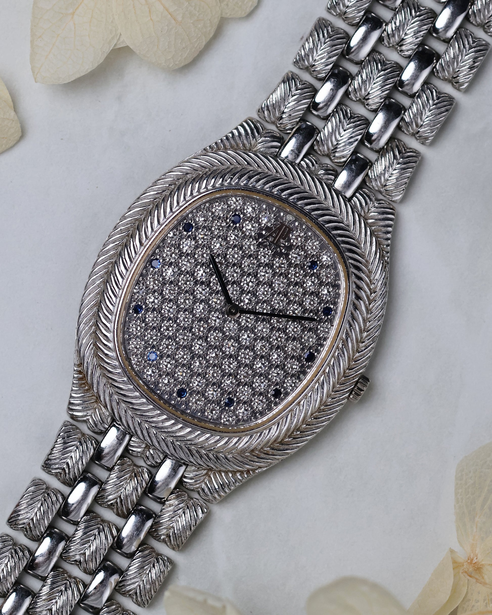 Side profile shot of the Audemars Piguet Feather highlighting the integrated bracelet and elegant case curvature.