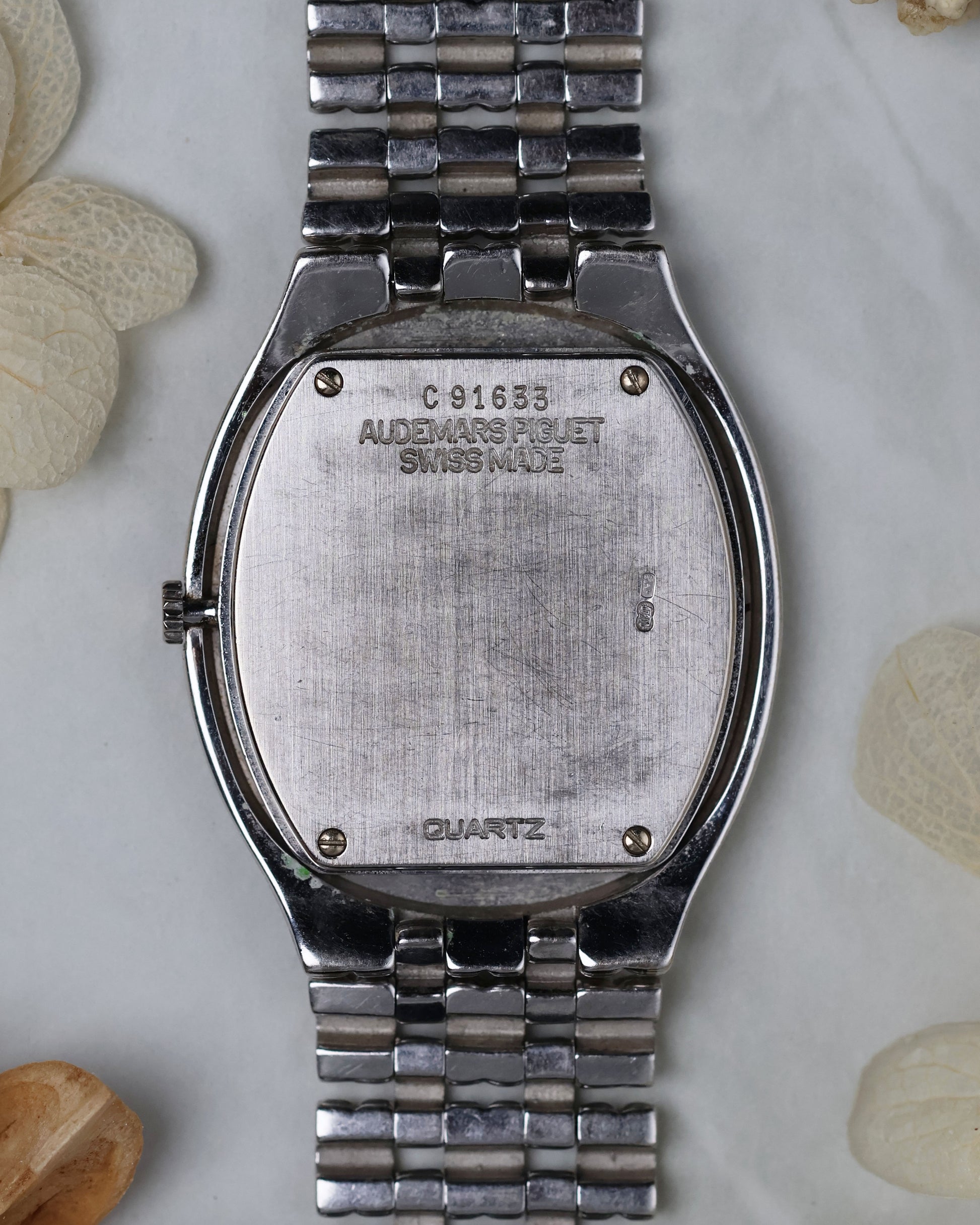Caseback view of the Audemars Piguet Feather, showing the smooth white gold finish and hallmarks