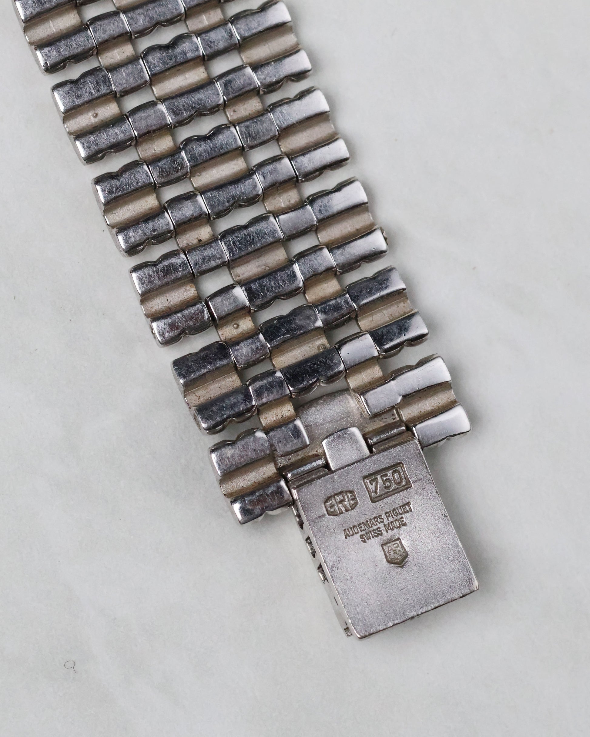 Close-up of the inside clasp showing Audemars Piguet engravings and gold hallmarks.