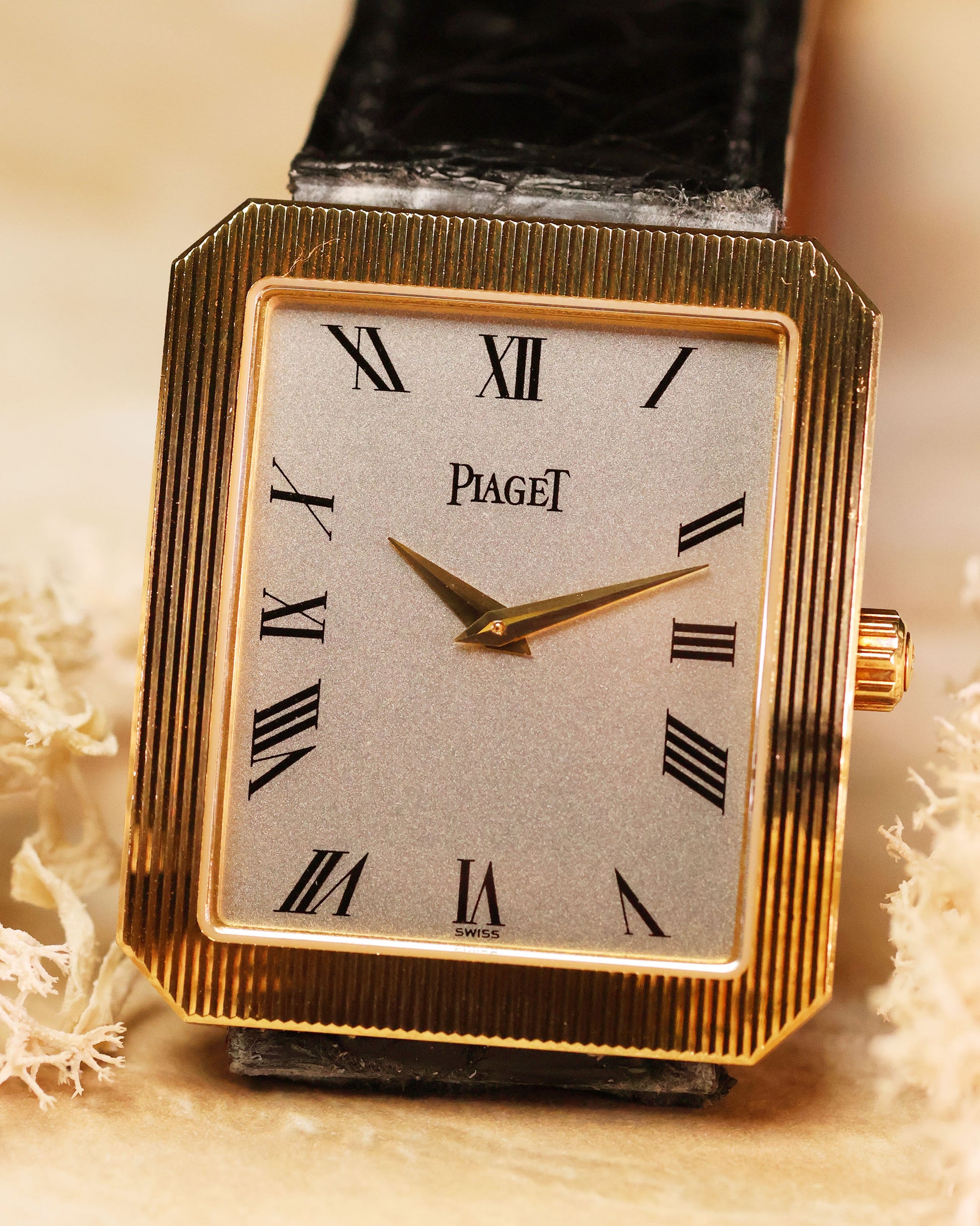 Silver dial of Piaget Protocole Jumbo 90154 with bold black Roman numerals and dauphine hands.