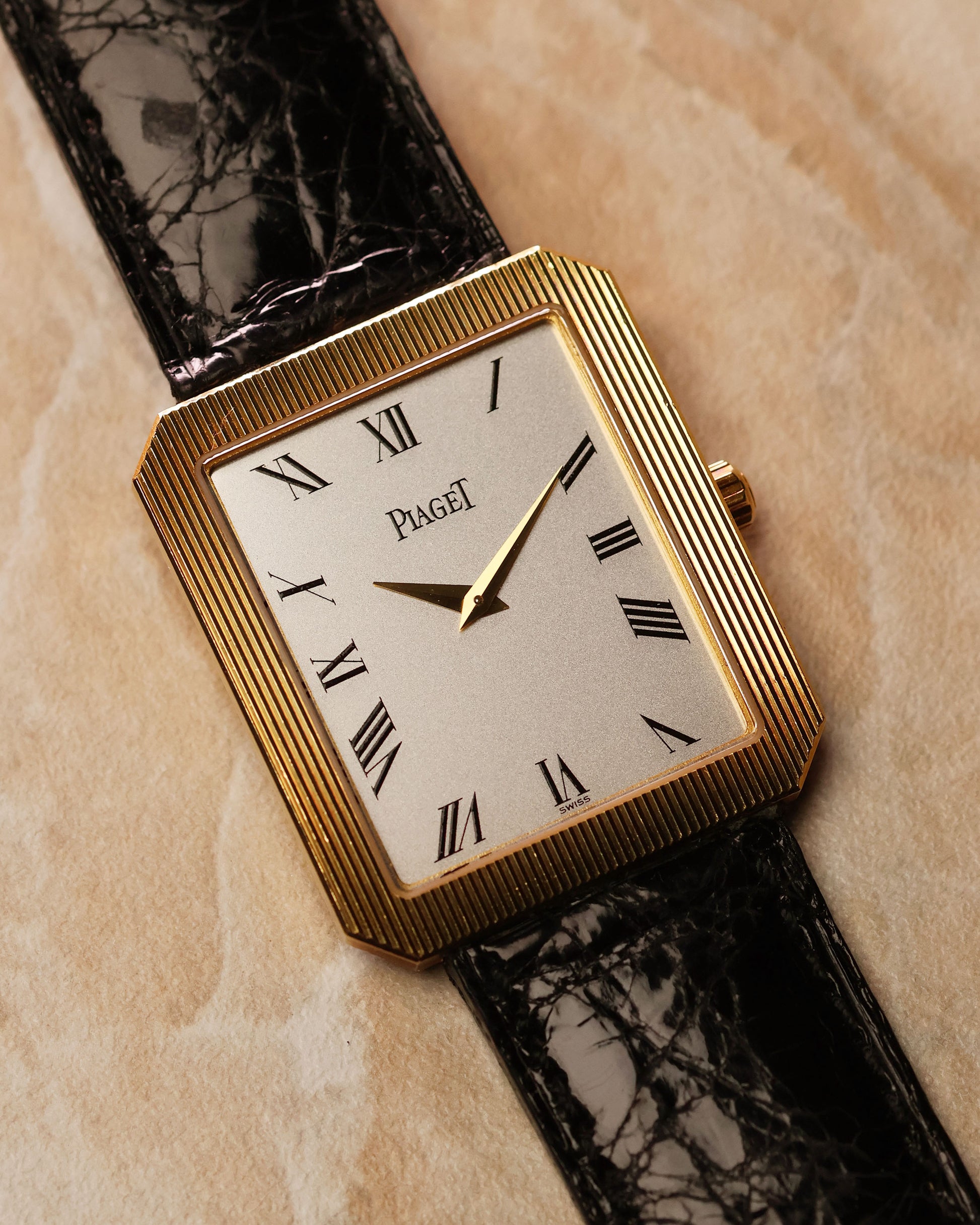 Piaget Protocole Jumbo 90154 angled view highlighting silver dial and gold dauphine hands.