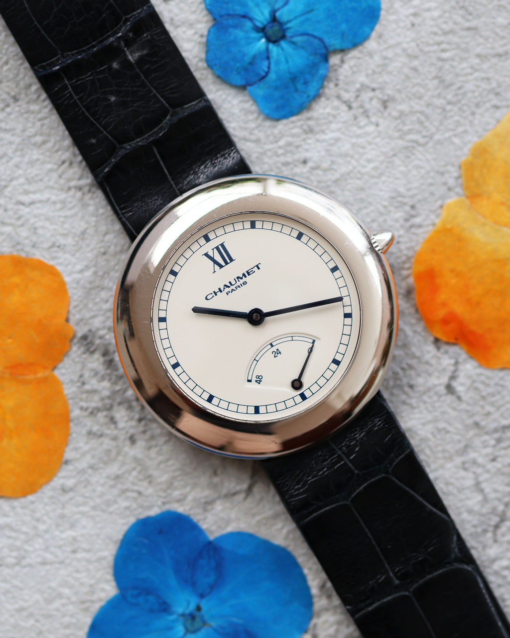Elegant 1990s Chaumet Dress Watch Ref. 12A in white gold on original strap, full frontal view.