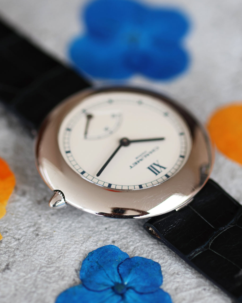 Chaumet Ref. 12A crown detail in white gold with sapphire crystal edge visible.