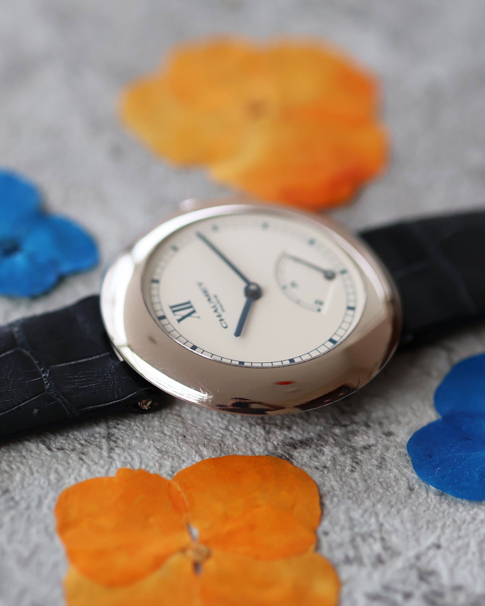 Slim profile of Chaumet Dress Watch Ref. 12A in 18K white gold, side view.