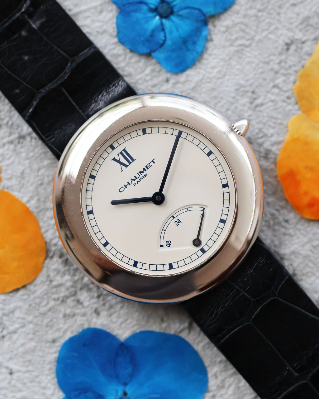 Chaumet Dress Watch Ref. 12A in 18K White Gold, silver dial with power reserve, front view.