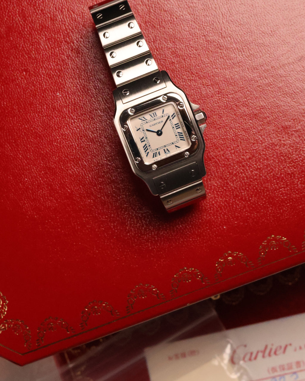 Cartier Santos Galbée Ref. 1565 placed on its original presentation box, papers visible