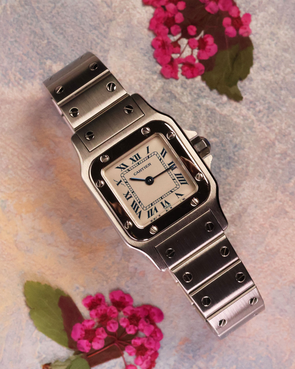Cartier Santos Galbée Ref. 1565 angled view highlighting polished bezel and Roman numerals