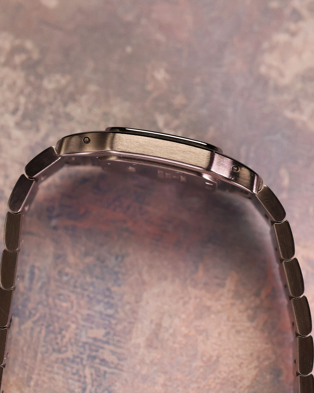 Cartier Santos Galbée Ref. 1565 side profile displaying slim stainless steel case and bracelet integration