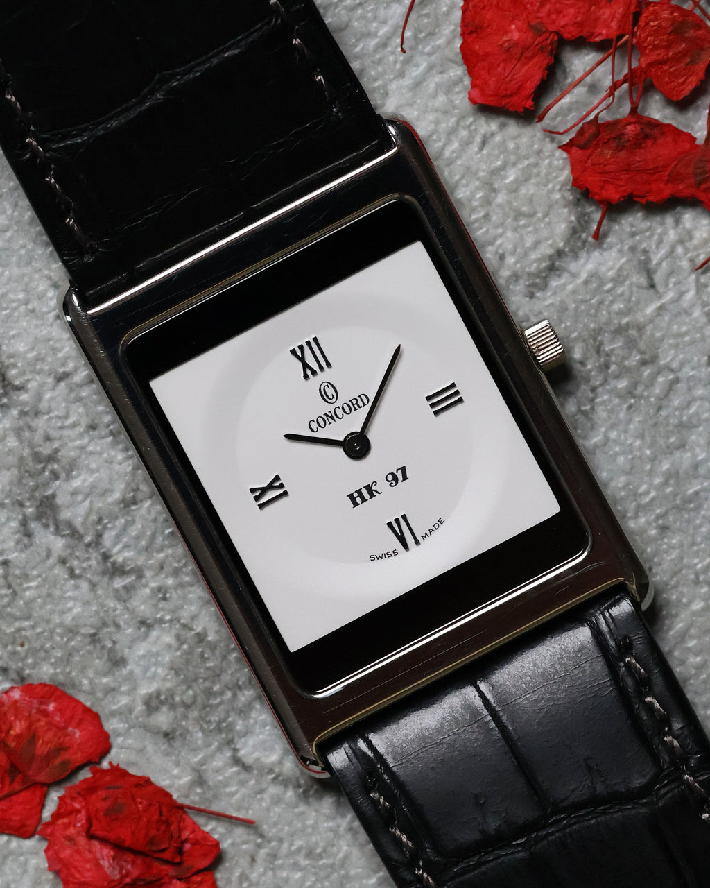 Close-up of the Concord Delirium commemorative dial featuring crisp Roman numerals and “HK 97” text