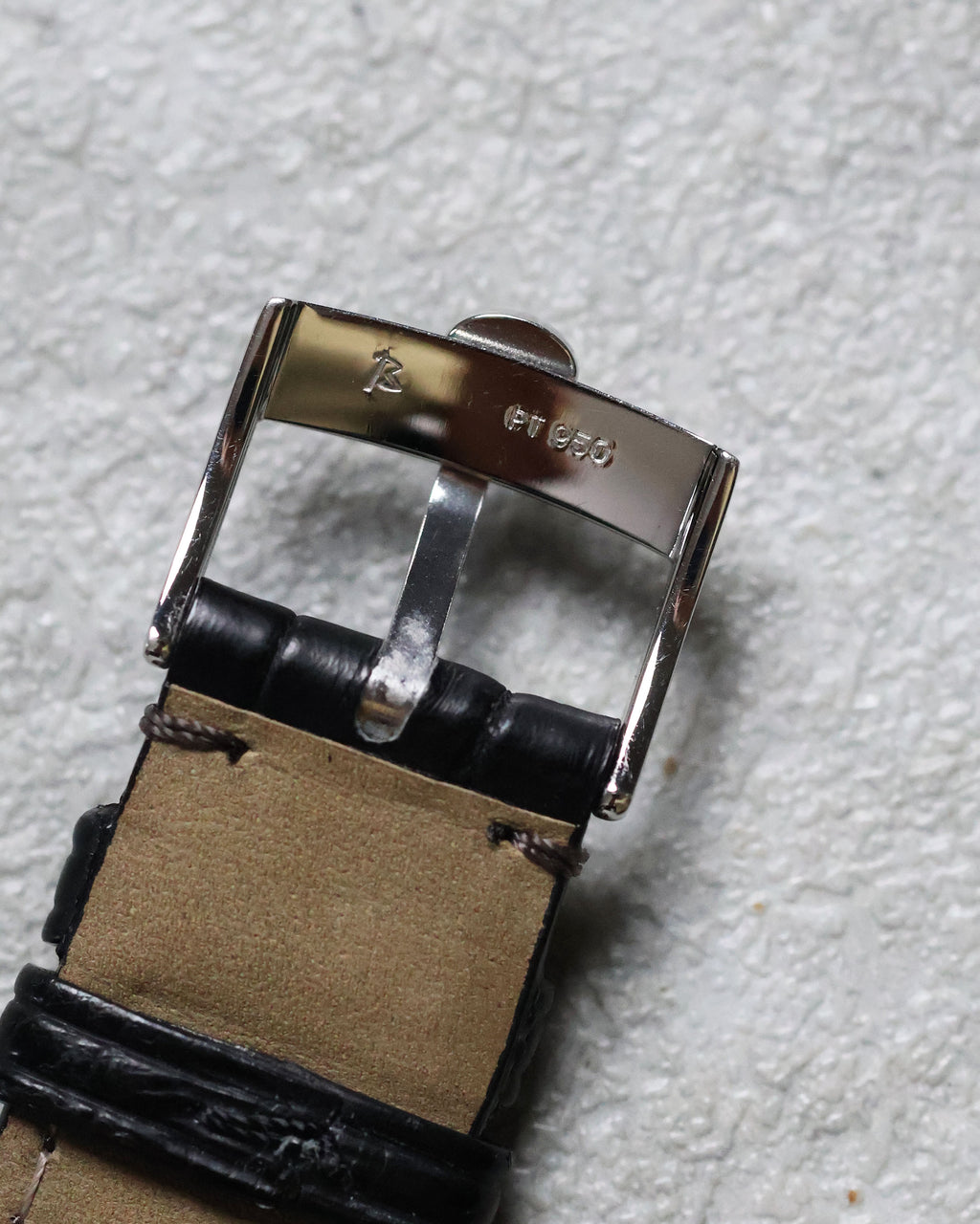 Underside of the Concord buckle showing refined finishing and clasp detail.