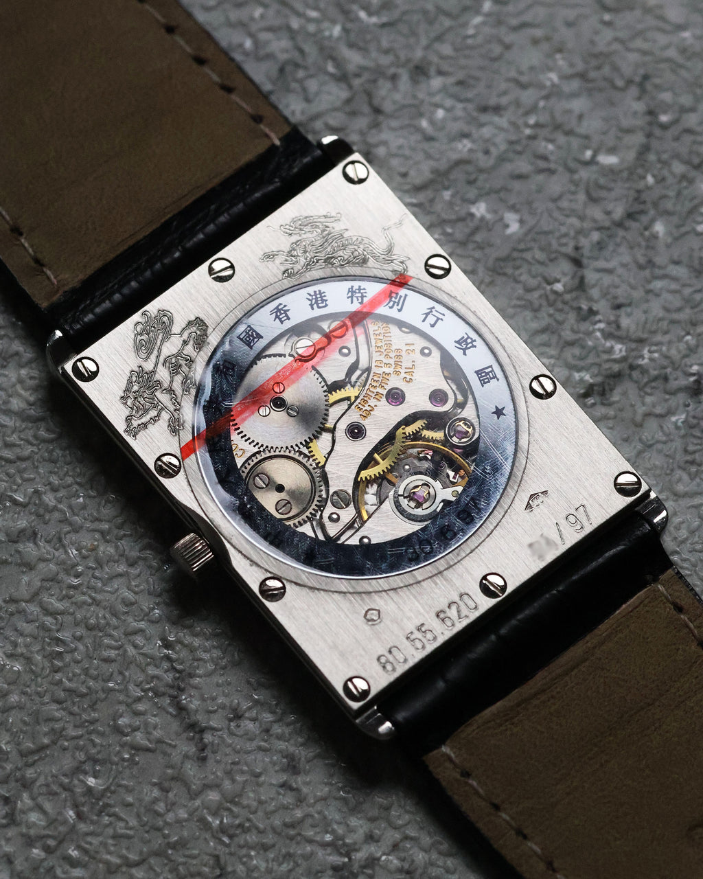 Macro shot of the transparent caseback showcasing the mechanical movement, a rare feature for Concord watches of this era.