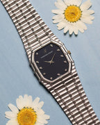 Audemars Piguet Bamboo 27mm in 18k white gold with dark blue matte dial and diamond hour markers, full view on integrated bracelet