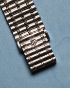 Close-up of Audemars Piguet Bamboo white gold clasp featuring engraved AP logo