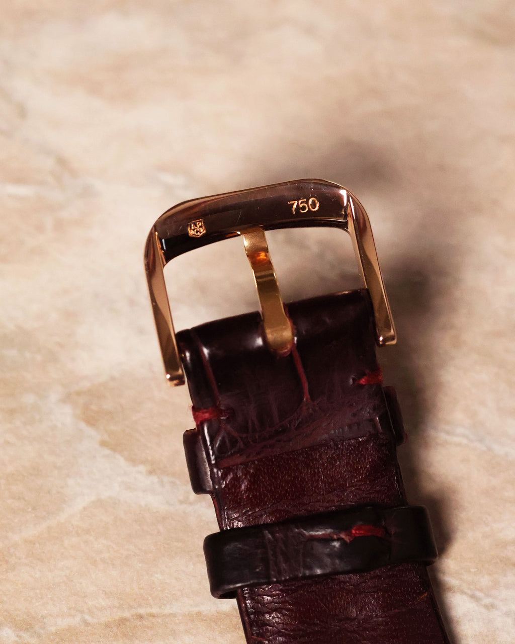 Underside of Audemars Piguet 18k rose gold buckle with engraved hallmarks and markings