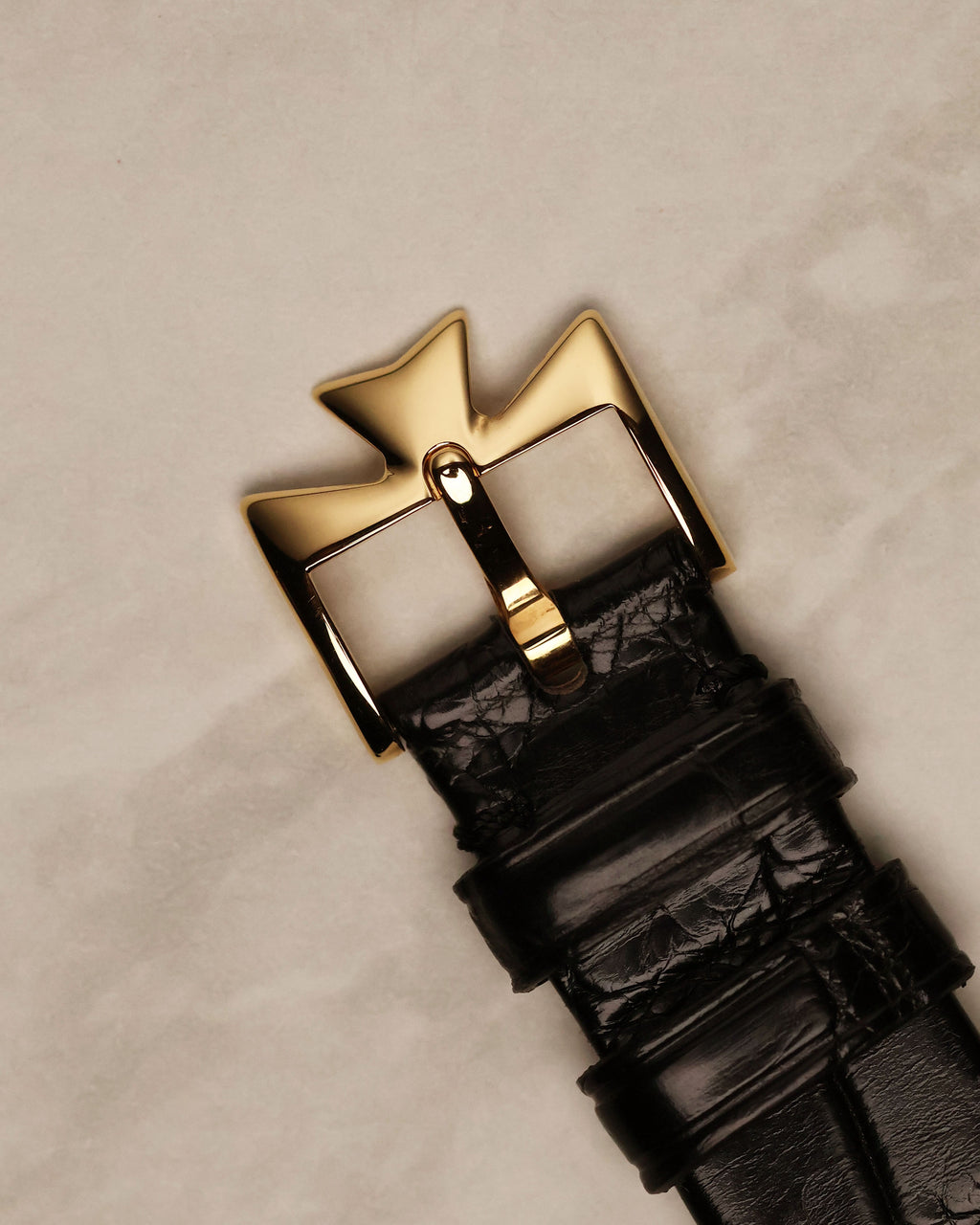 Top view of original 18k yellow gold Vacheron Constantin buckle on leather strap