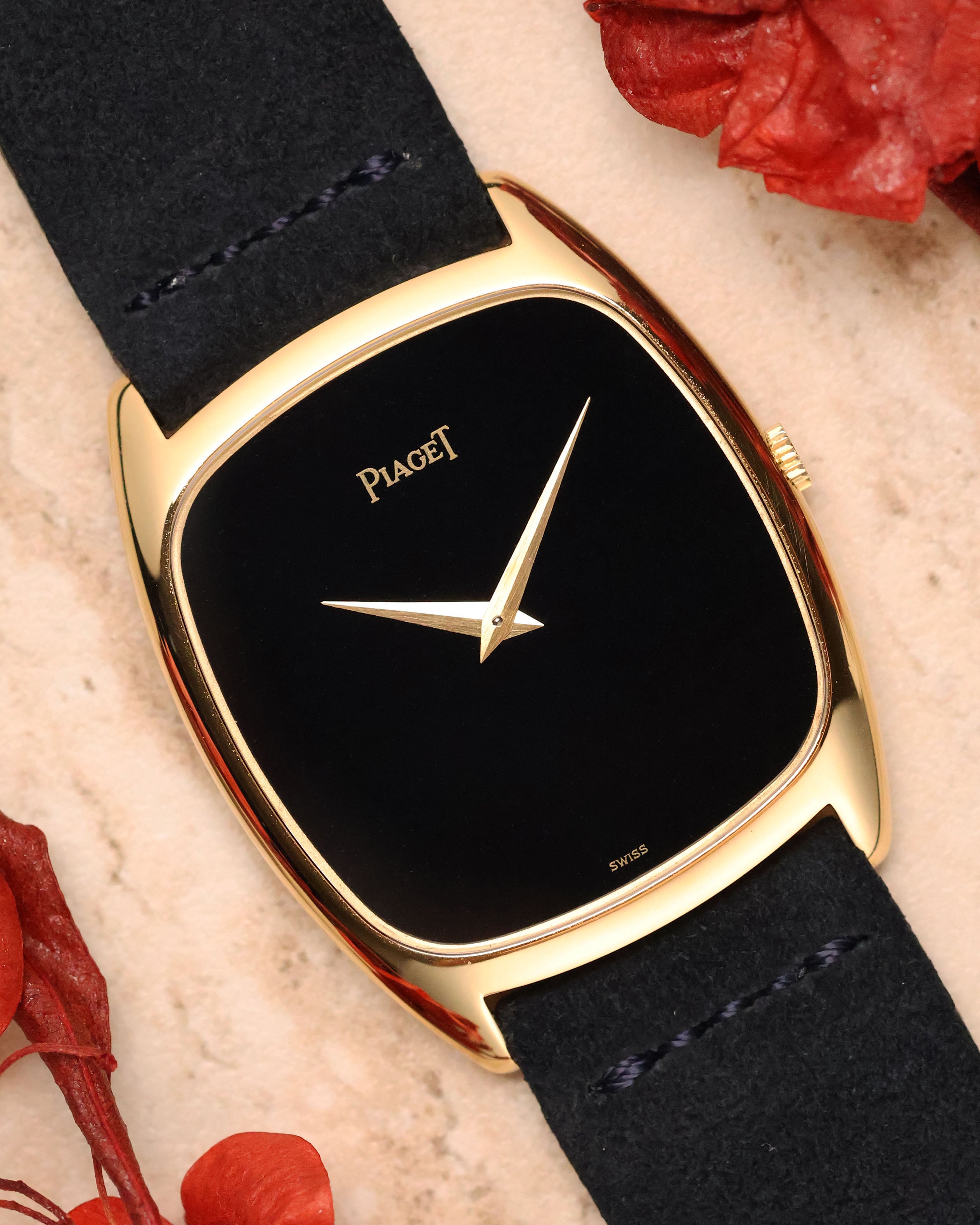 Piaget Ref. 9591 in 18k yellow gold with minimalist black lacquer dial and gold dauphine hands, cushion-shaped case.