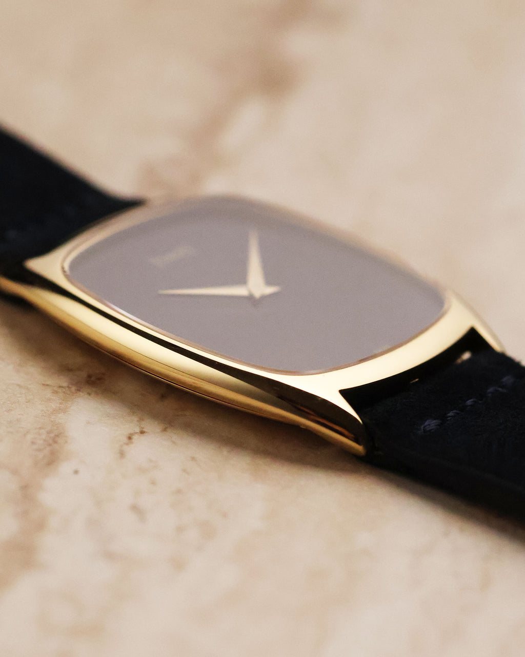 Side view emphasizing the ultra-thin yellow gold case and curved cushion shape of the Piaget 9591.