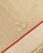 Detailed view of the owl hallmarks and maker’s mark “GL with dagger,” confirming French import and 18k gold purity.