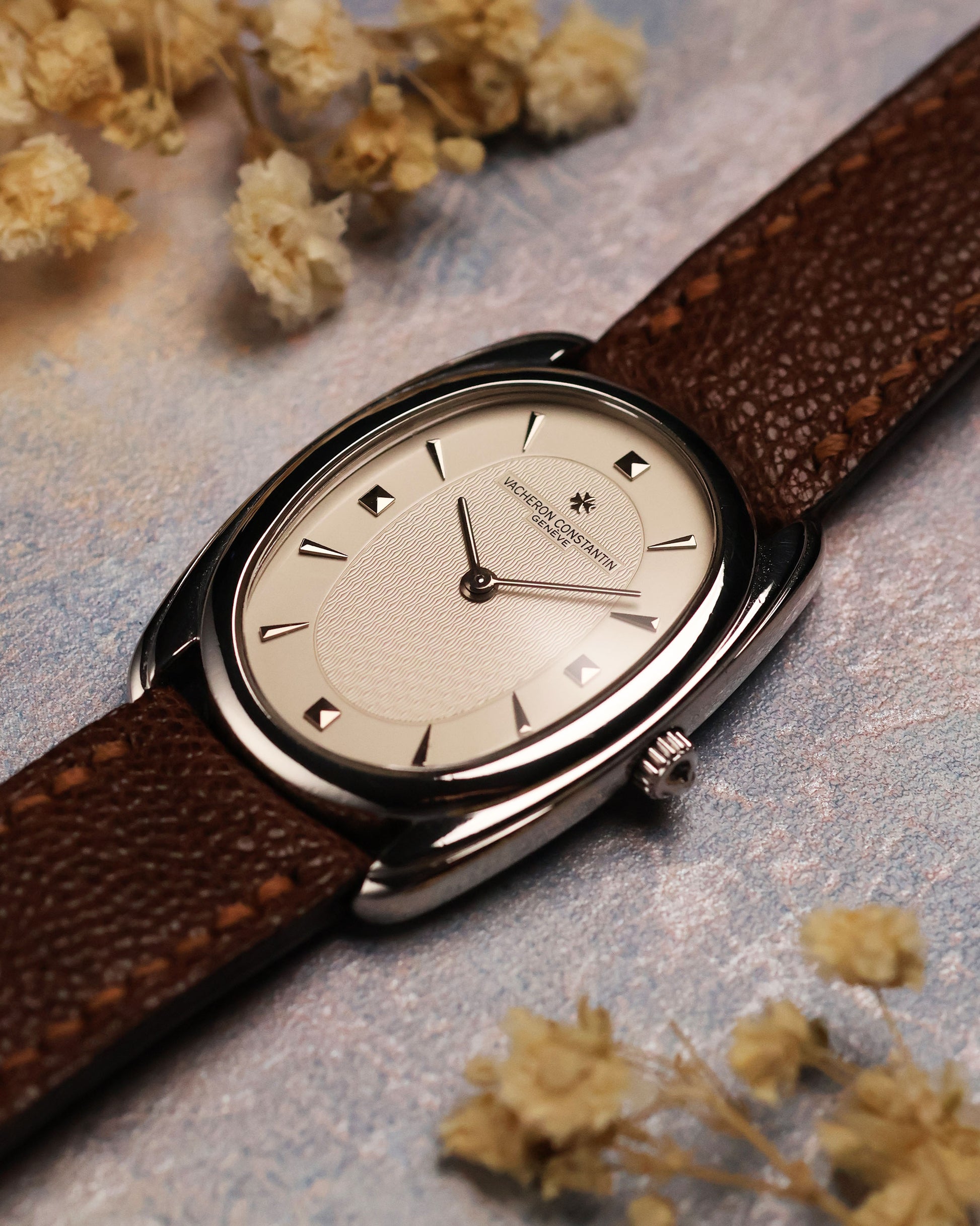 Vacheron Constantin Historiques 31110 platinum – three-quarter view highlighting the curvature of the case and minimalist guilloché dial texture under soft lighting.