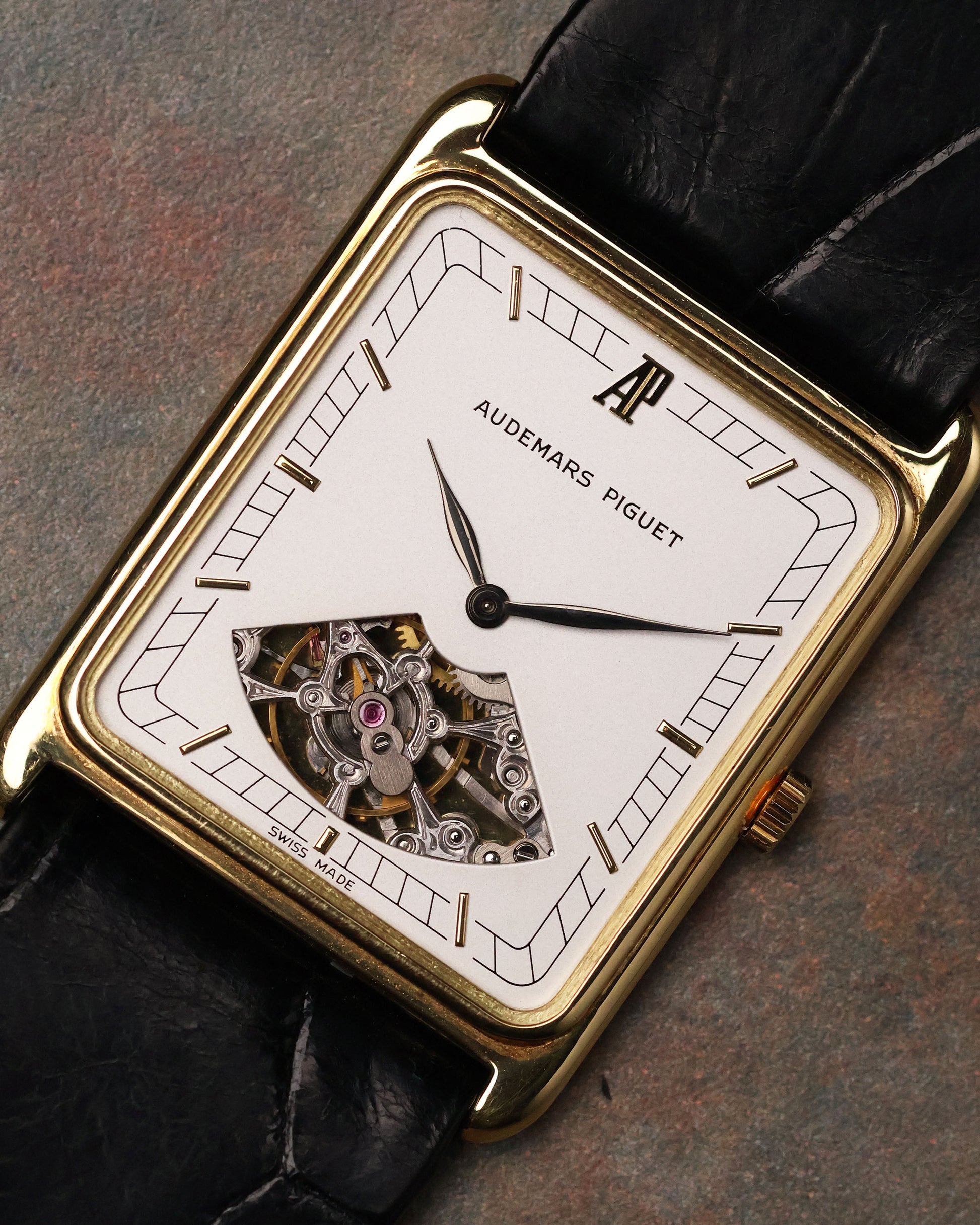 Macro shot of Audemars Piguet Skeleton Aperture Tank dial showing partial skeleton aperture and exposed bridges.