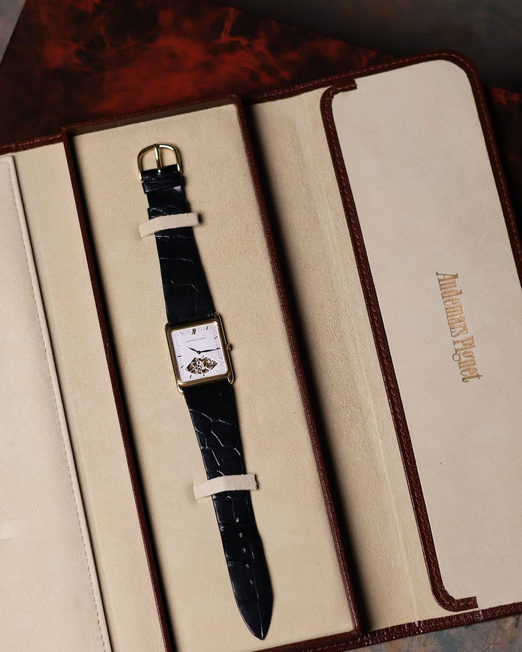 Full view of Audemars Piguet Skeleton Aperture Tank watch inside original presentation box with watch pouch.