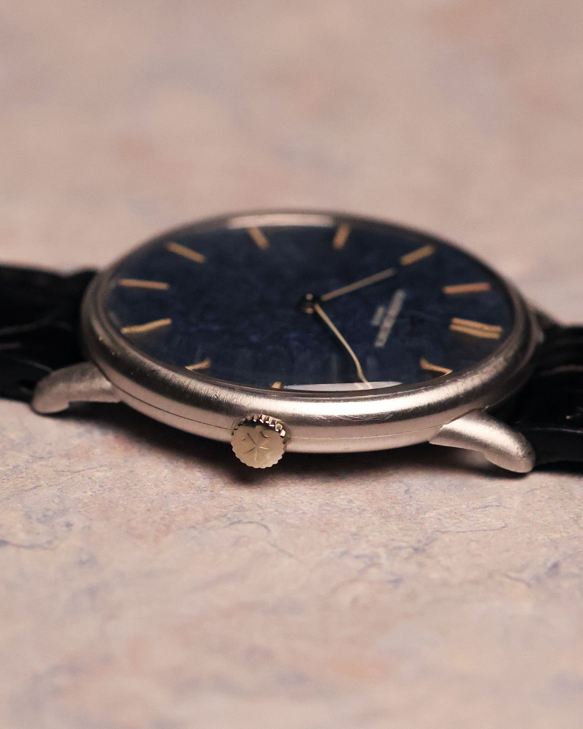 Side profile of the Vacheron Constantin Ref. 2006 focusing on the signed crown and thin lugs of the white-gold case.