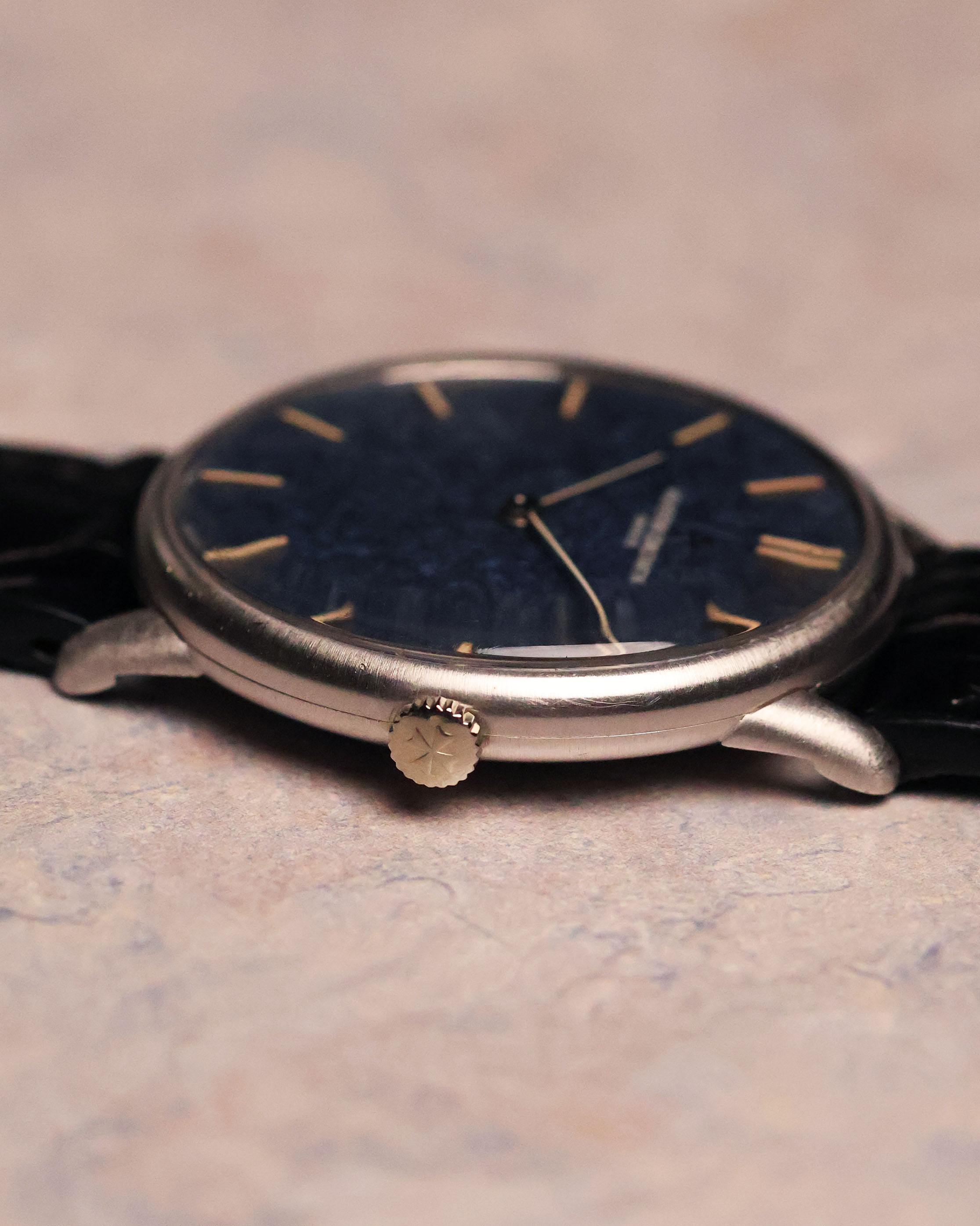 Side profile of the Vacheron Constantin Ref. 2006 focusing on the signed crown and thin lugs of the white-gold case.