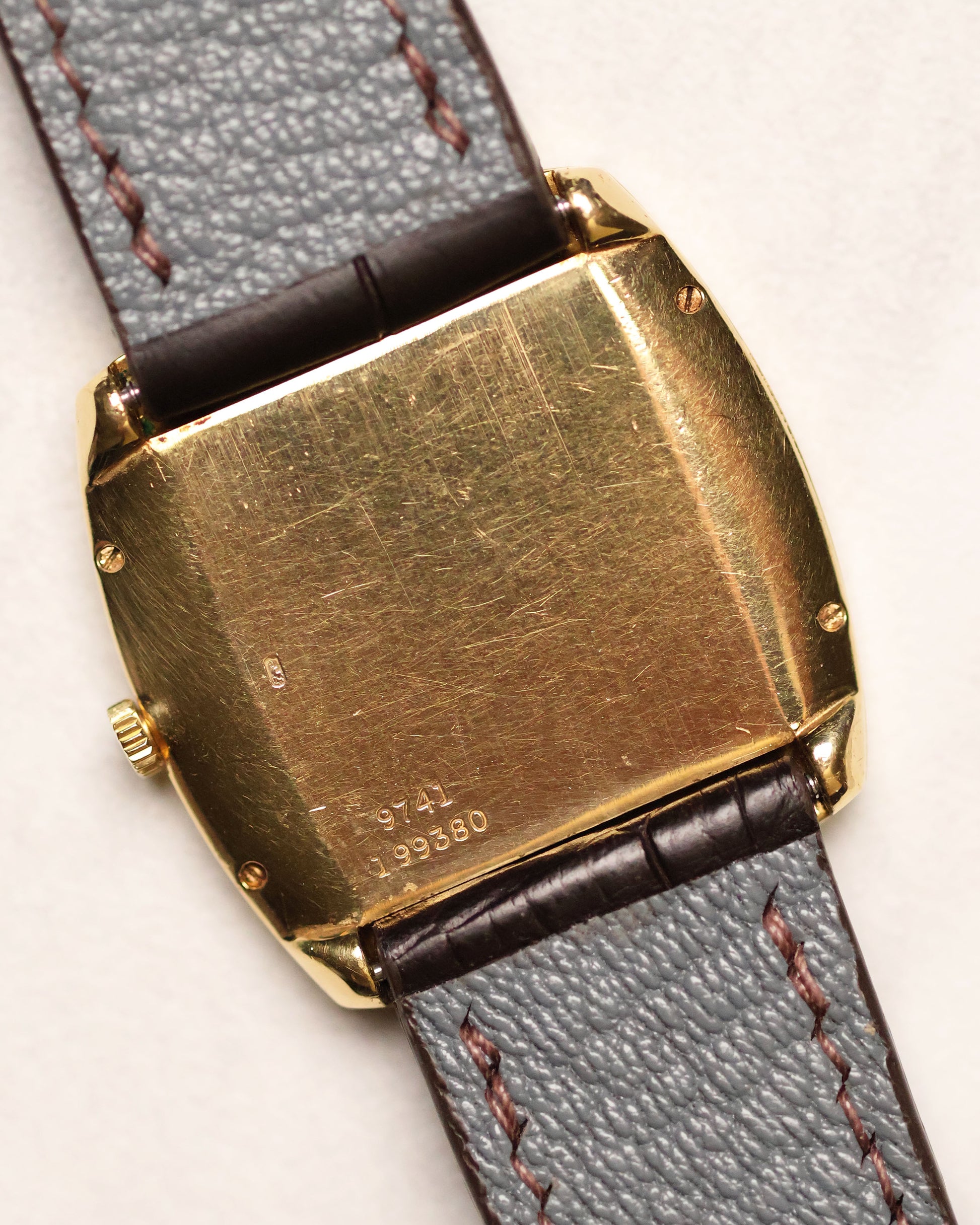Caseback view of Piaget Ref. 9741 showing 18K gold hallmark, model number 9741, and serial engraving 199380.