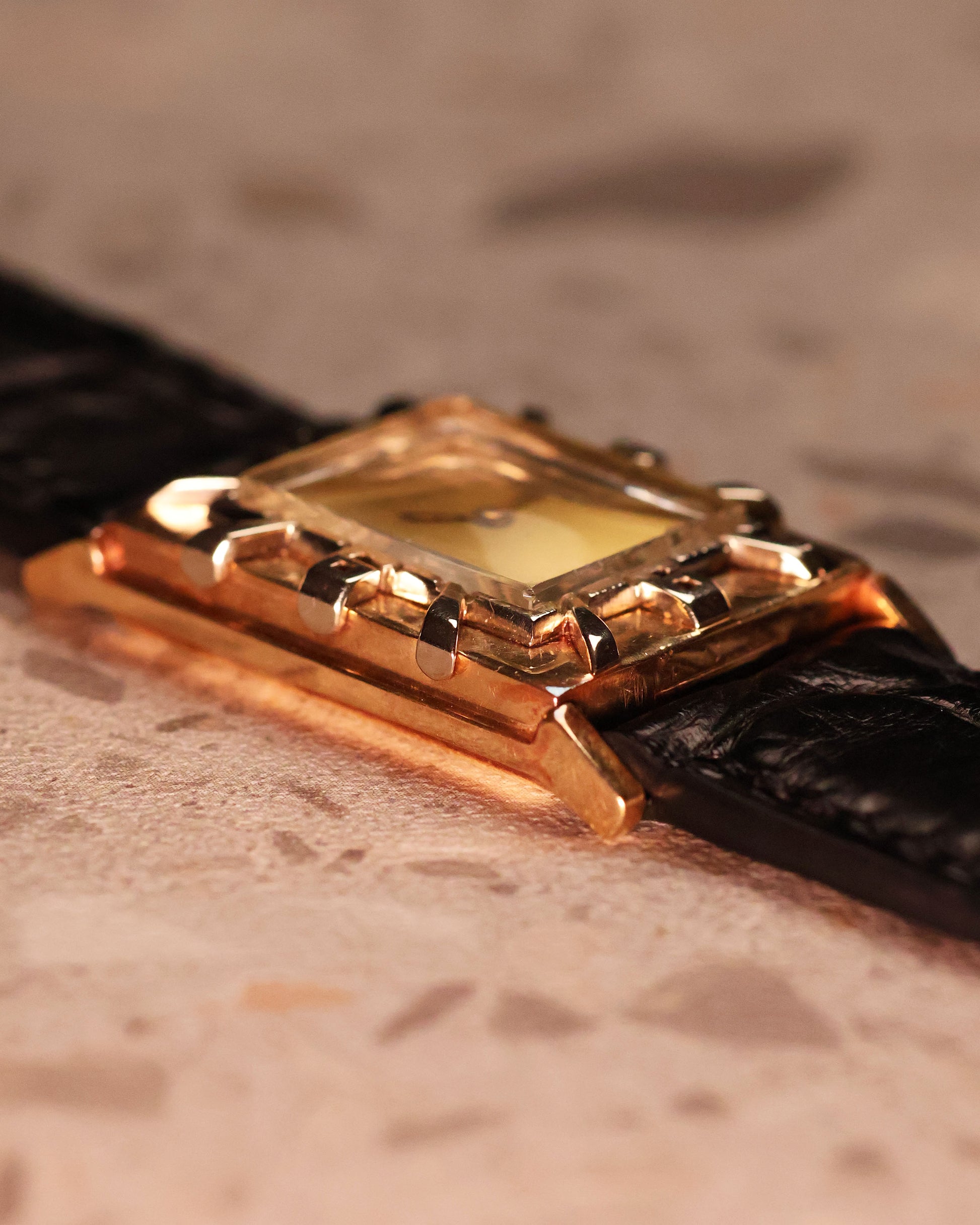 Macro shot of the LeCoultre watch focusing on the layered bezel architecture and elegant Art Deco numerals.