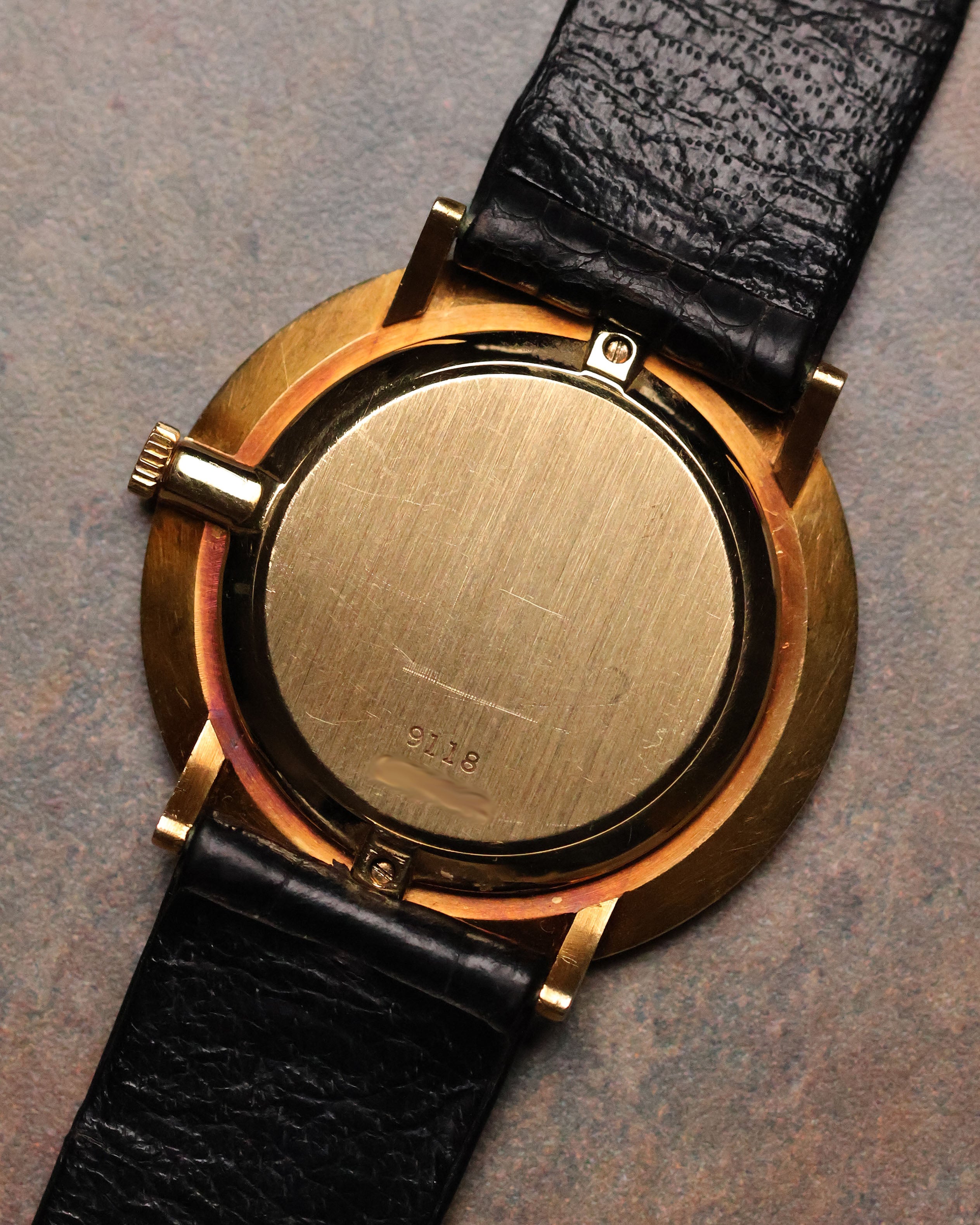 Reverse view of the Piaget Ref. 9118 showing the solid 18K gold caseback stamped with the reference number.